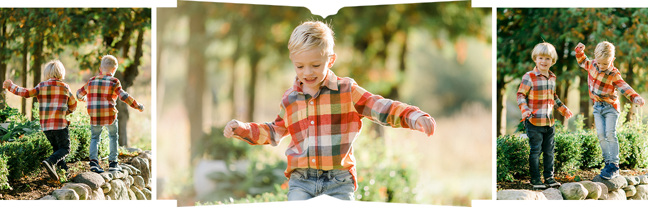 2 young boys playing on a stone wall in Northern Michigan