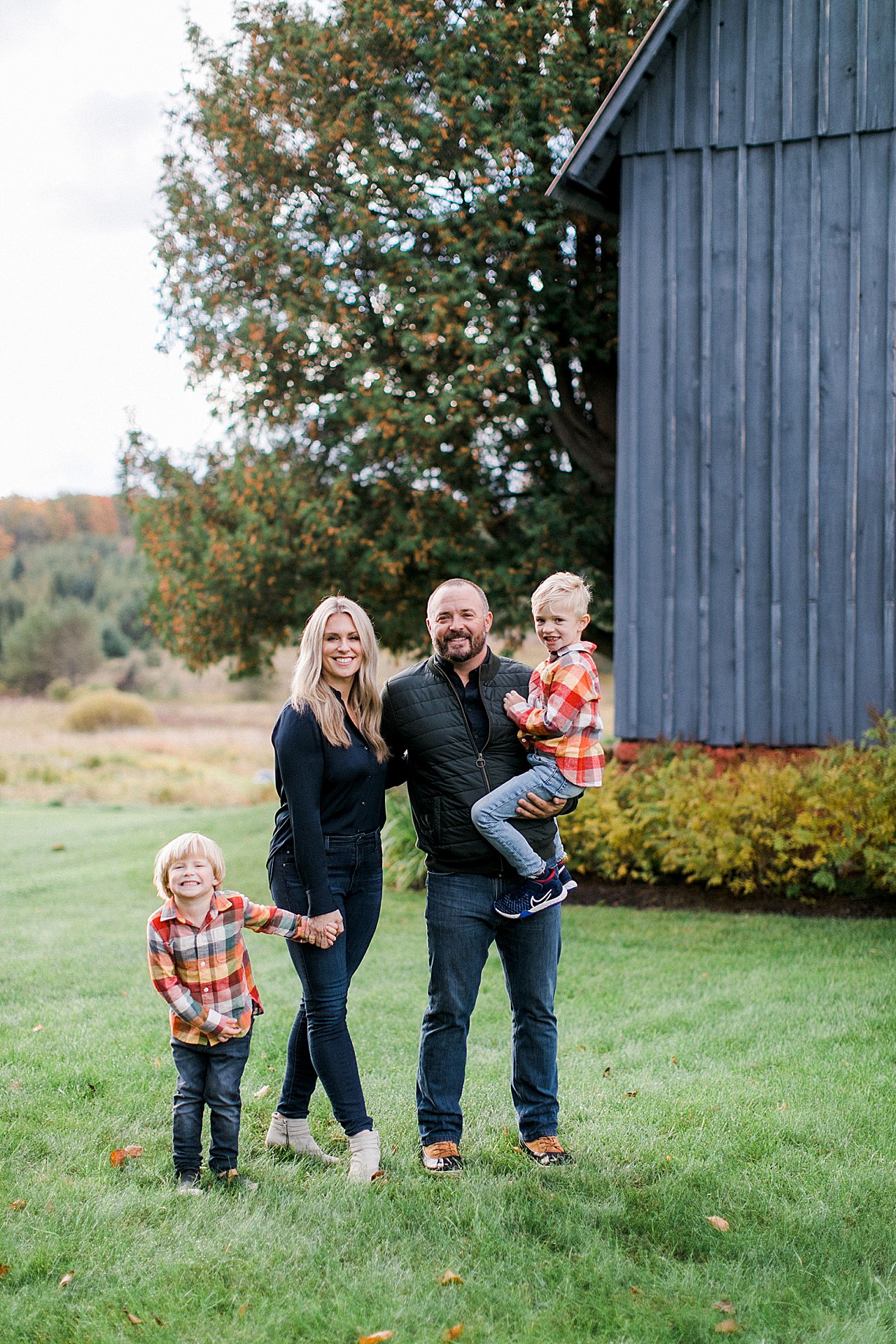 Family portrait of a mother, father, and their 2 boys Petoskey, Michigan