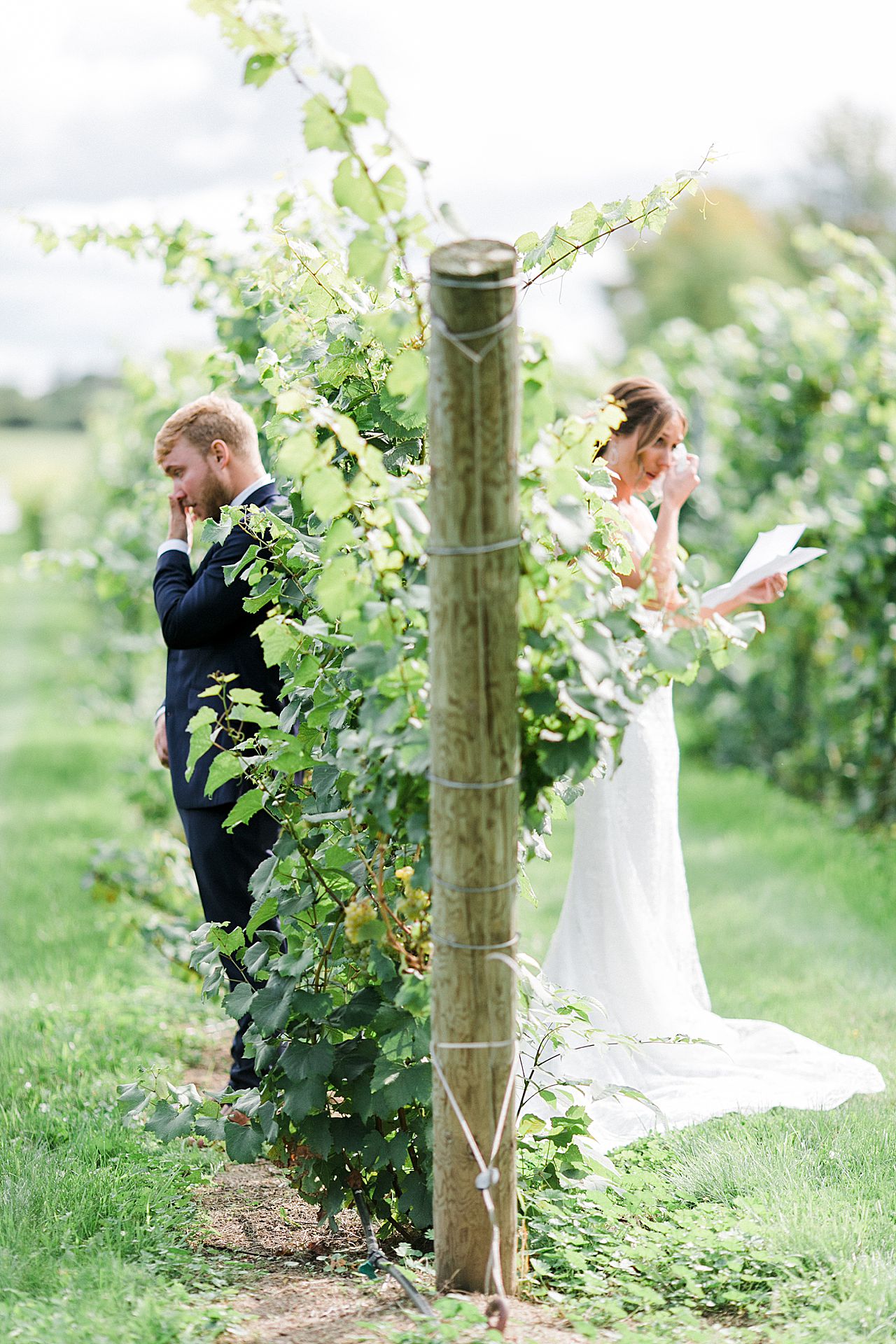 A bride and groom reading letters to each other in Michigan