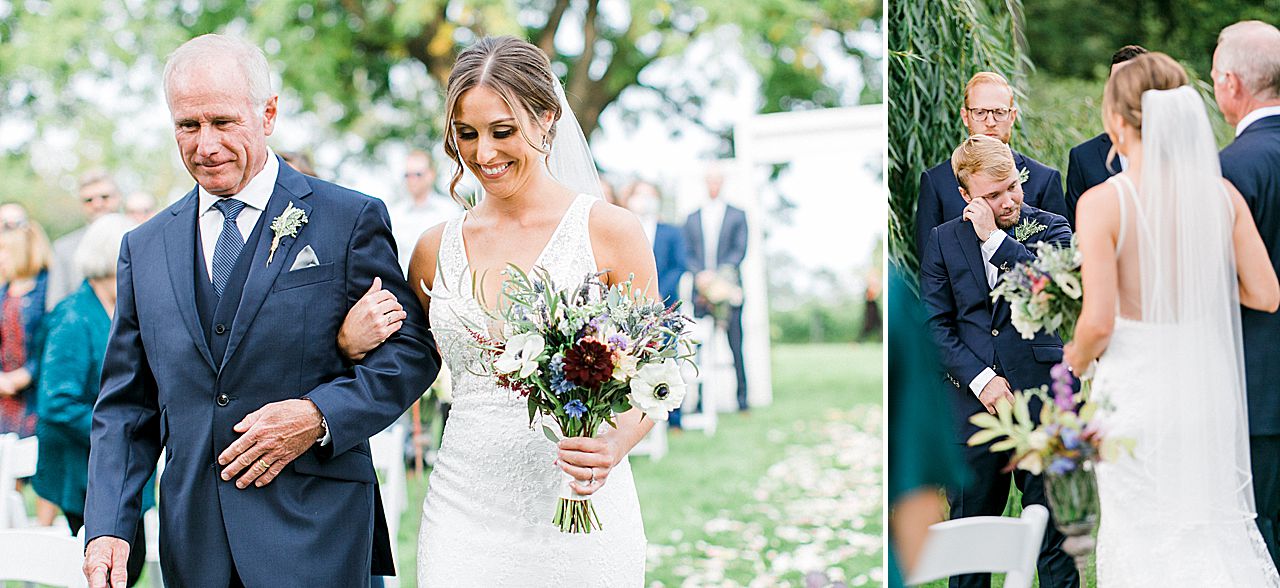 A groom tearing up with happiness while seeing his bride for the first time