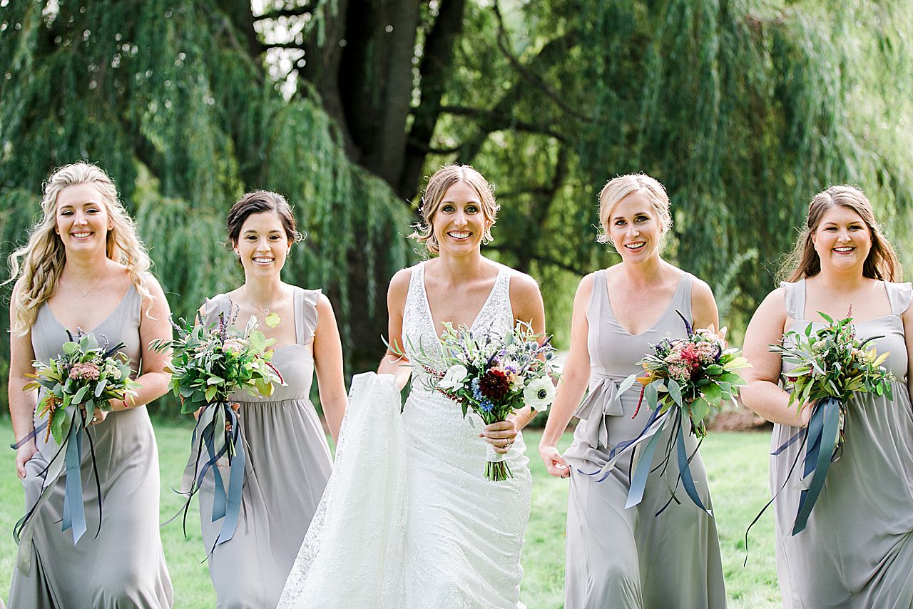 A bride walking with her bridesmaids