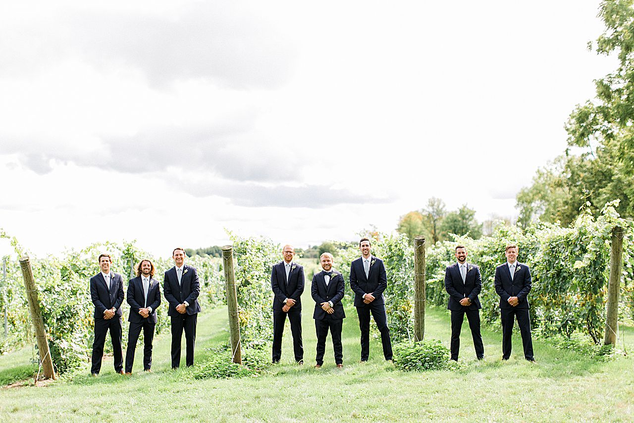 Groom and groomsman portraits in a Vineyard at Aurora Cellars
