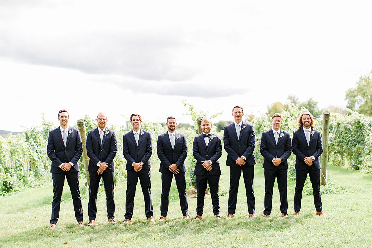 Groom and groomsman portraits in a Vineyard in Northern Michigan