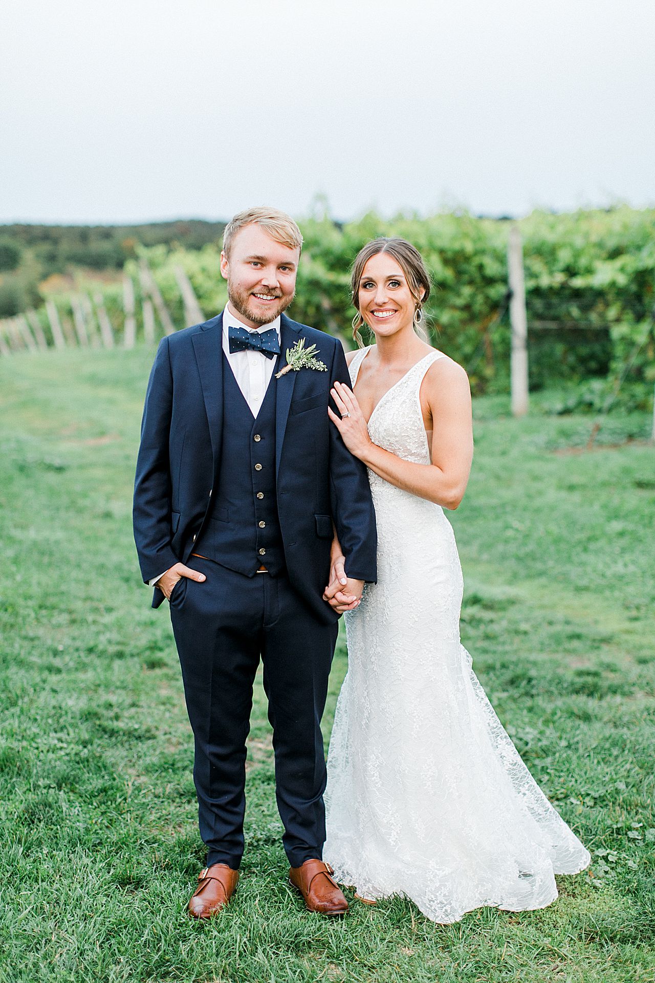 A bride and groom in the vineyards at Aurora Cellars