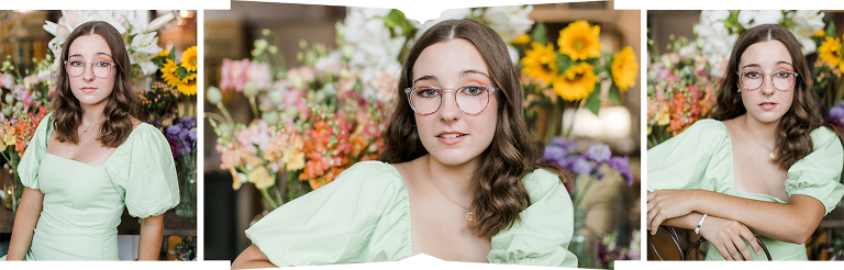 A senior portrait session in Northern Michigan with a girl wearing a green dress and glasses in a floral shop