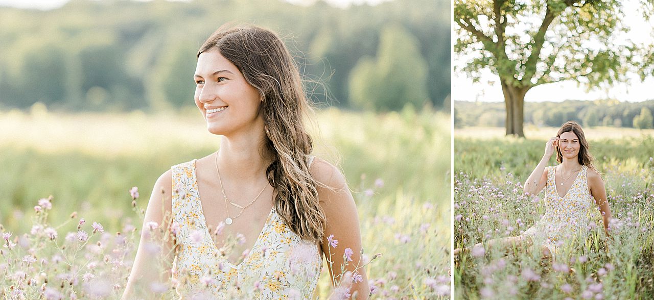 A girl sitting in a field in Leelanau Peninsula Michigan during her senior portrait photography session