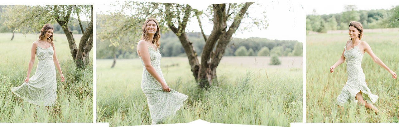 A senior portrait of a girl running through a field in a light green dress in Empire, Michigan