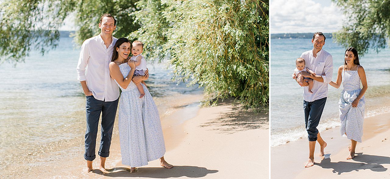 A family of three walking along Little Traverse Bay in Michigan