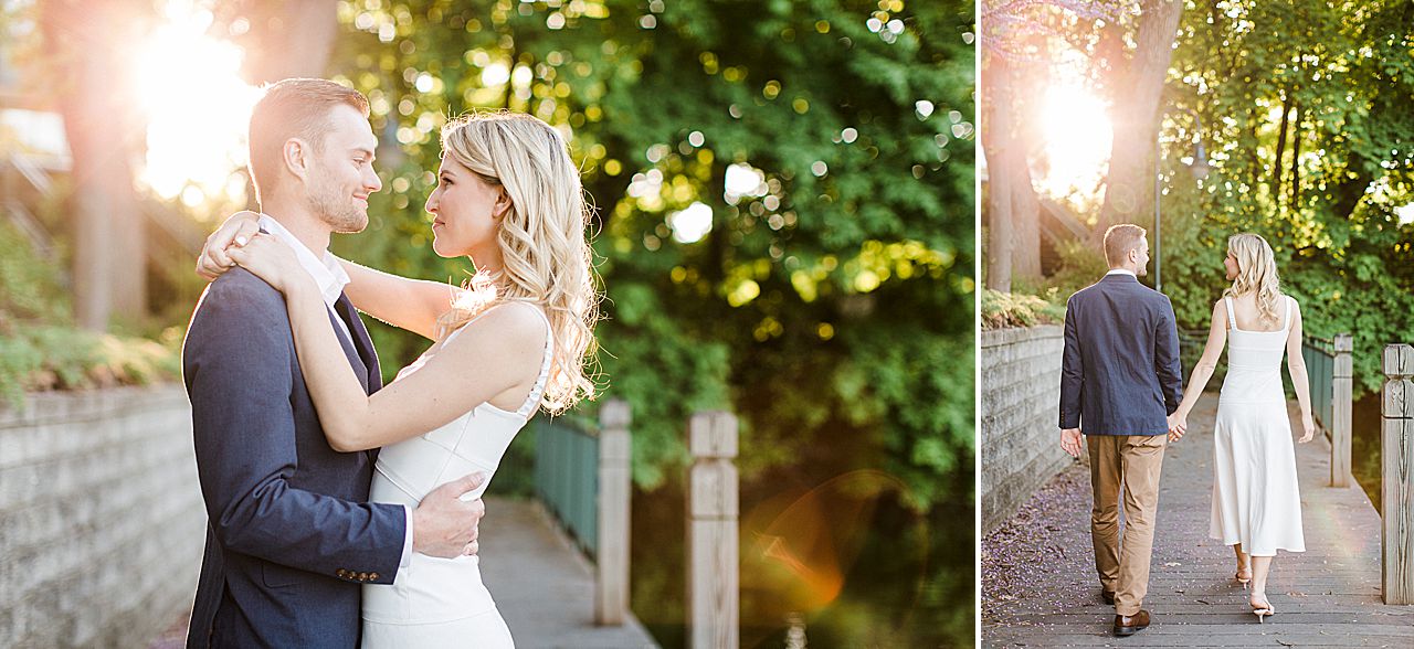 A couple walking on a boardwalk at sunset in Northern Michigan with the sun shining on them