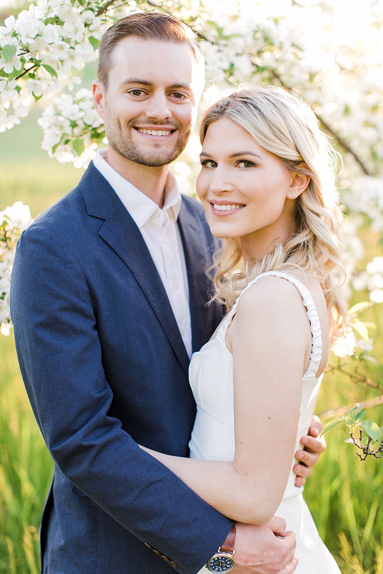 Springtime engagement photos of a couple on Old Mission Peninsula in Michigan at sunset