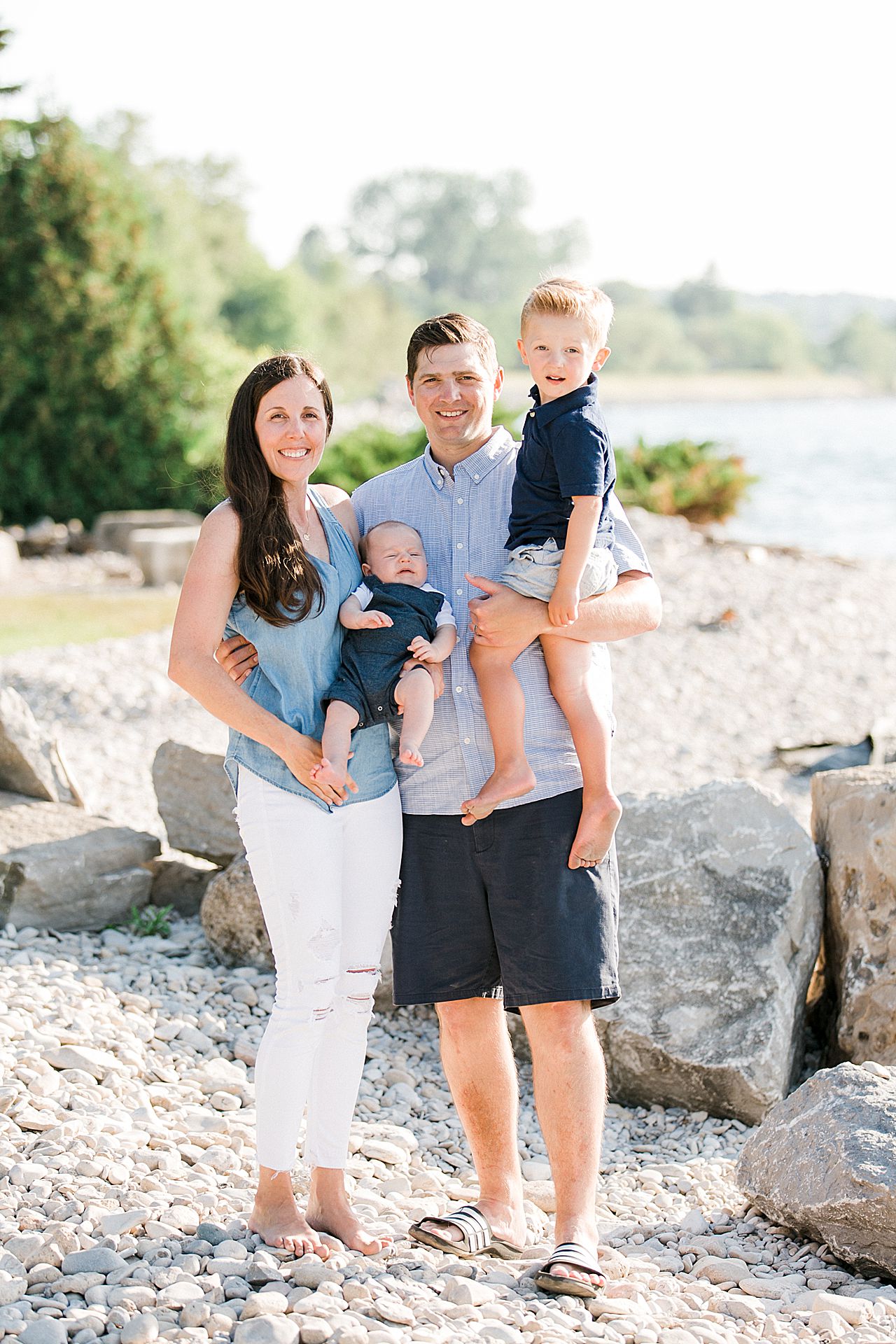 A portrait of a mother, father, and their 2 young sons in Petoskey, Michigan