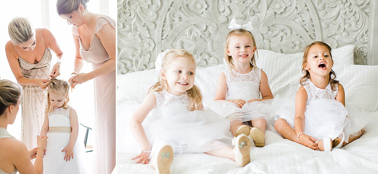 Flower girls sitting on a bed in Bay Harbor, Michigan
