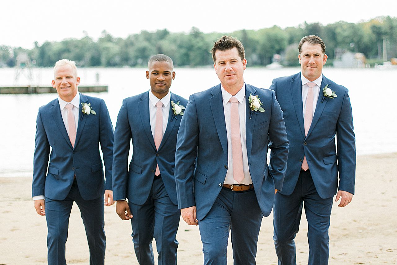 A groom and groomsmen by the water in Northern Michigan