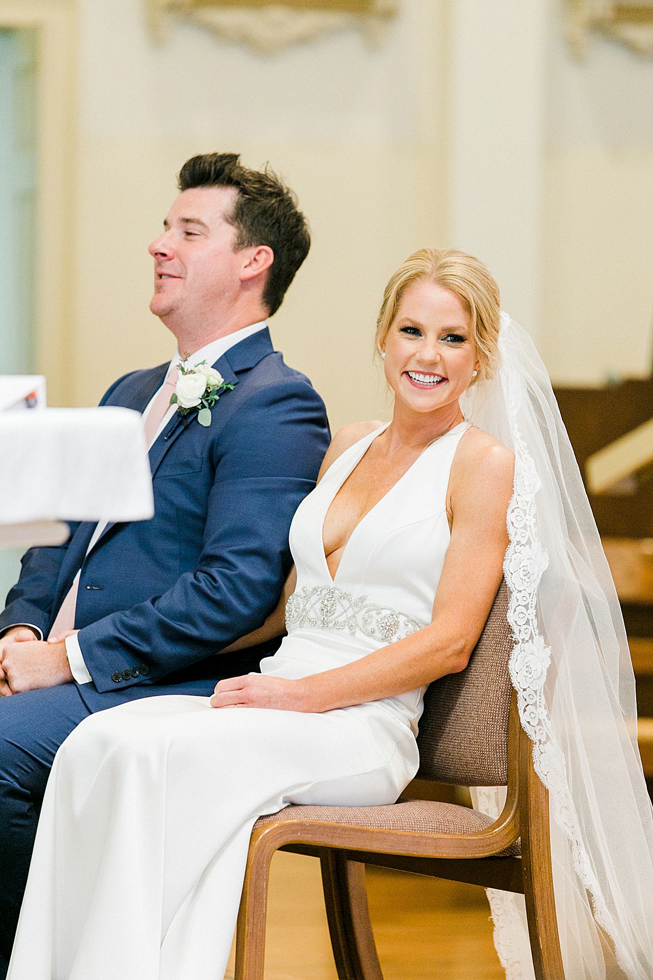 A bride laughing during her wedding ceremony in Harbor Springs, Michigan