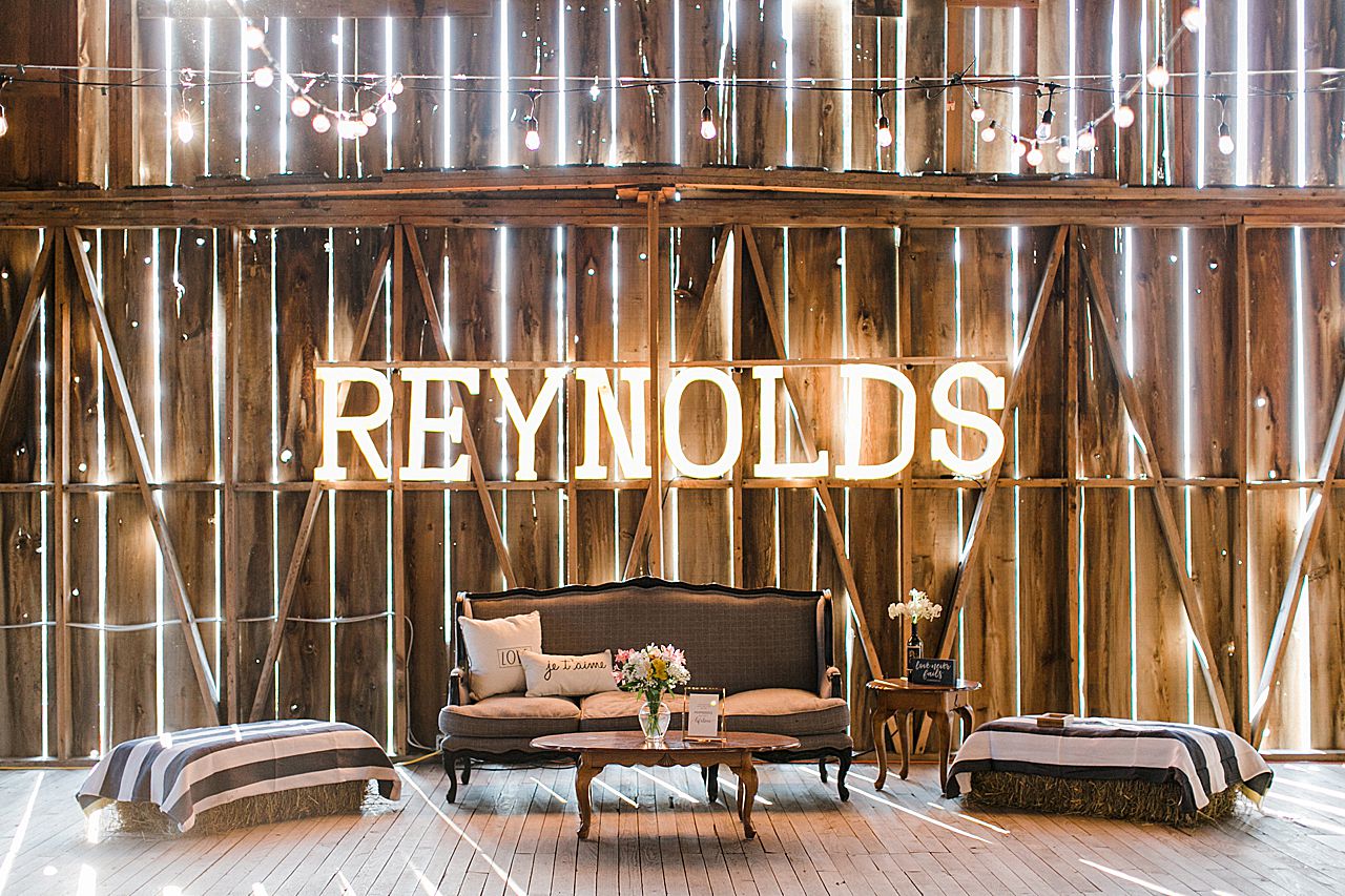 Light up lettering that says the couples last name in the dancing area of Shanahan's Barn in Charlevoix, Michigan