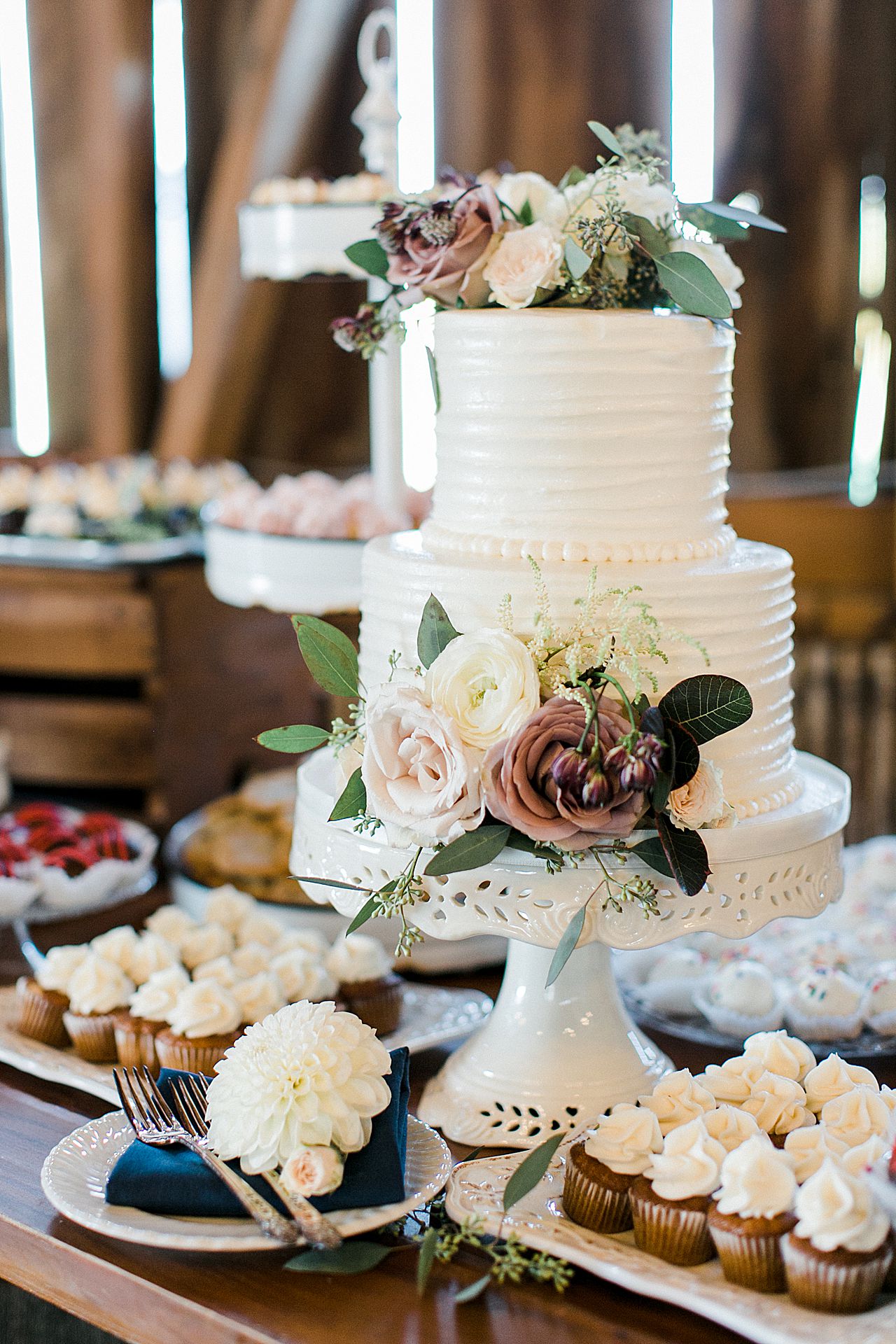 A wedding cake with flowers on the top