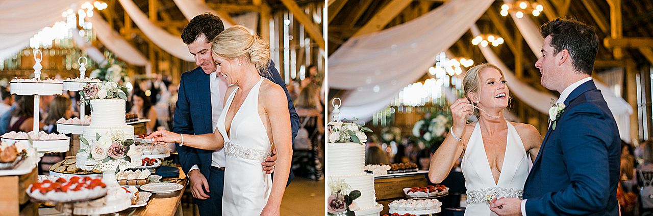 A bride and groom cutting their wedding cake at their wedding reception in Shanahan's Barn in Charlevoix, Michigan
