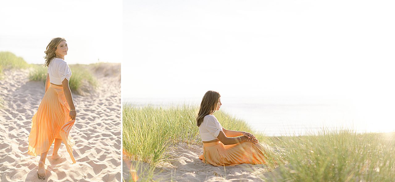 A high school senior girl taking portraits along Lake Michigan in Charlevoix