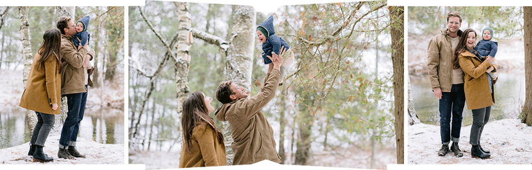 A mother and father playing with their baby outside in the snow