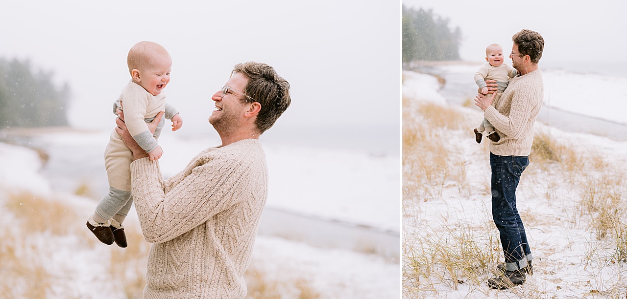 A baby boy hanging out with his father near a creek in the winter