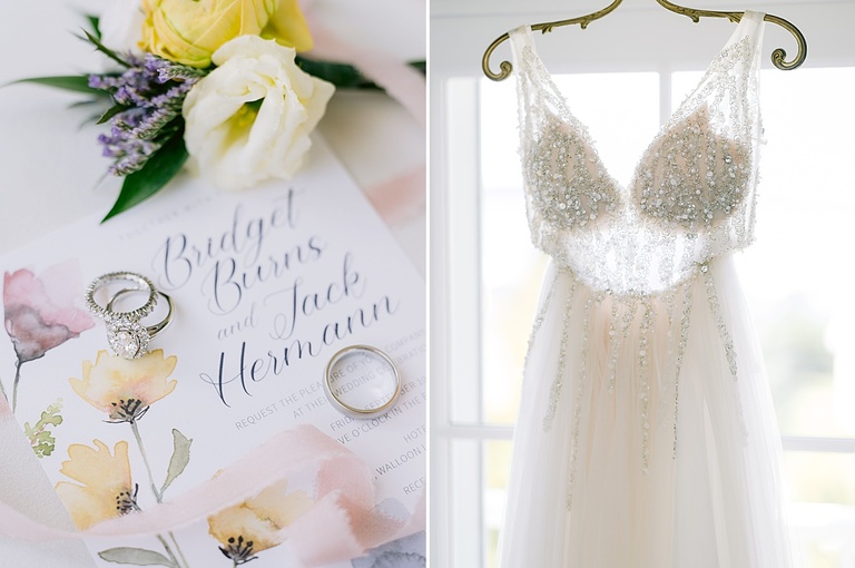 Gorgeous details of bridal gown hanging in a window and beautiful wedding bands on invitation suite.
