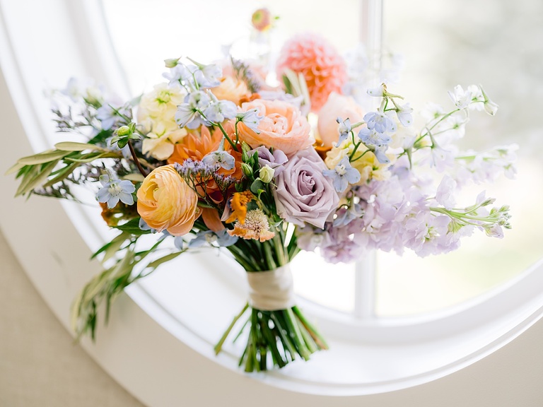 A lovely, pastel bouquet in a circular window on Walloon Lake.