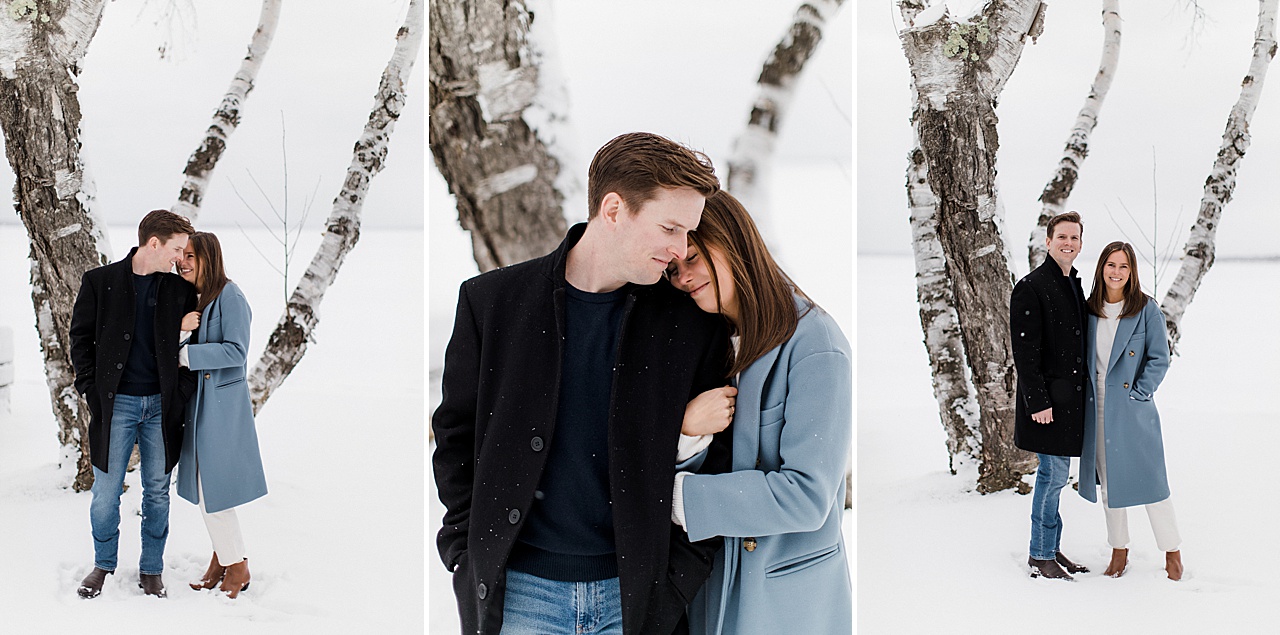A couple snuggled up outside in the winter on Mullett Lake in Michigan