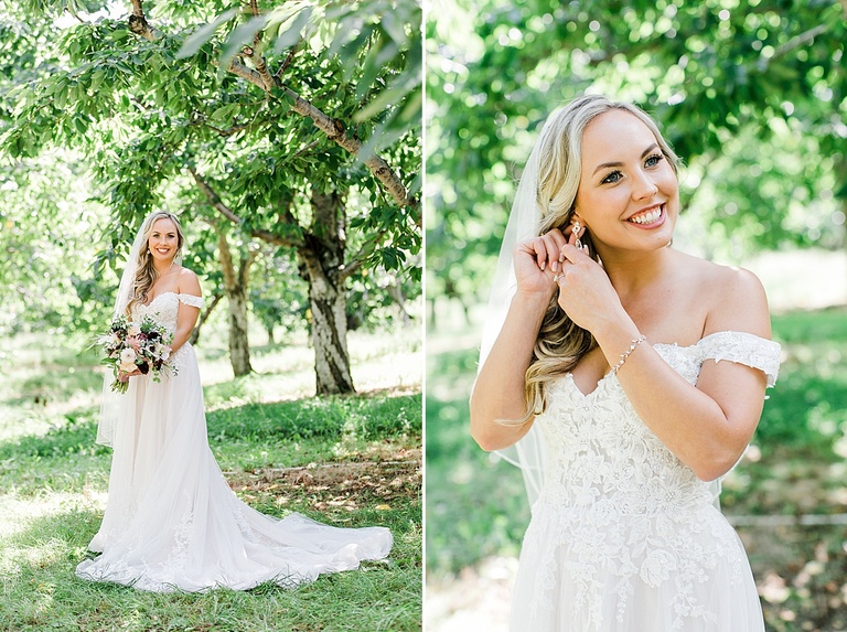A bride taking portraits in an orchard in Northern Michigan on her wedding day