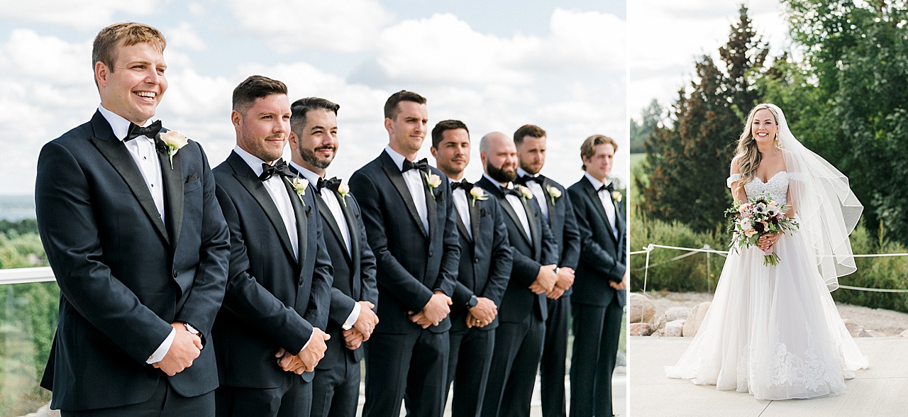A groom looking at his bride walking down the aisle and smiling at Bay View Weddings at Gallagher Farms
