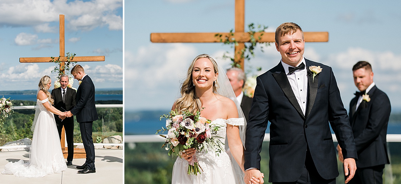 A bride and groom praying together at their ceremony before their first kiss