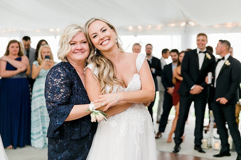 A bride dancing with her mother