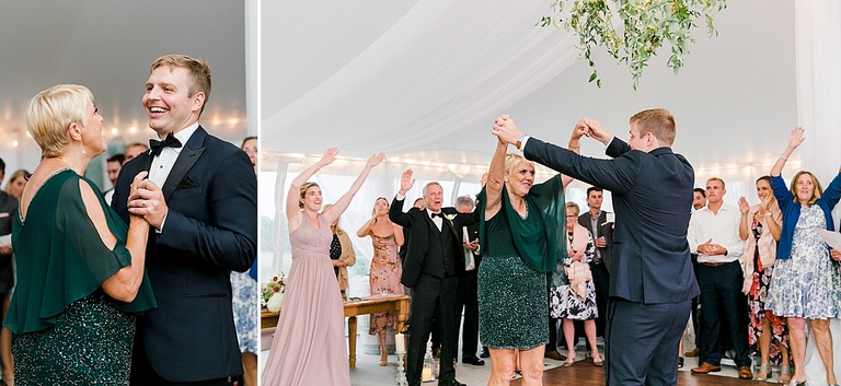 A groom and his mother dancing together under a reception tent
