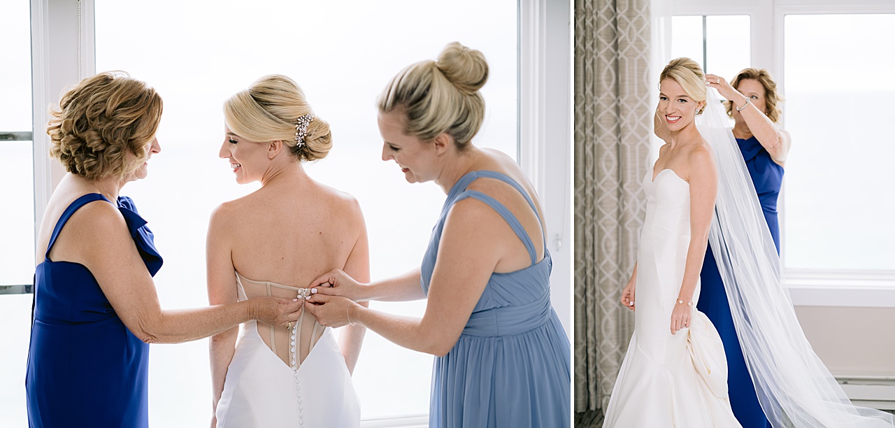 A bridesmaid and a bride’s mother help her into her dress and place her veil in Northern Michigan