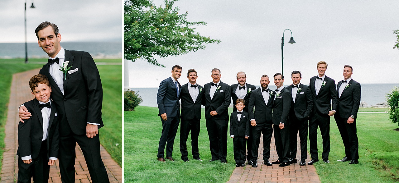 A groom hugs ring bearer and poses with the groomsmen in Petoskey, Michigan