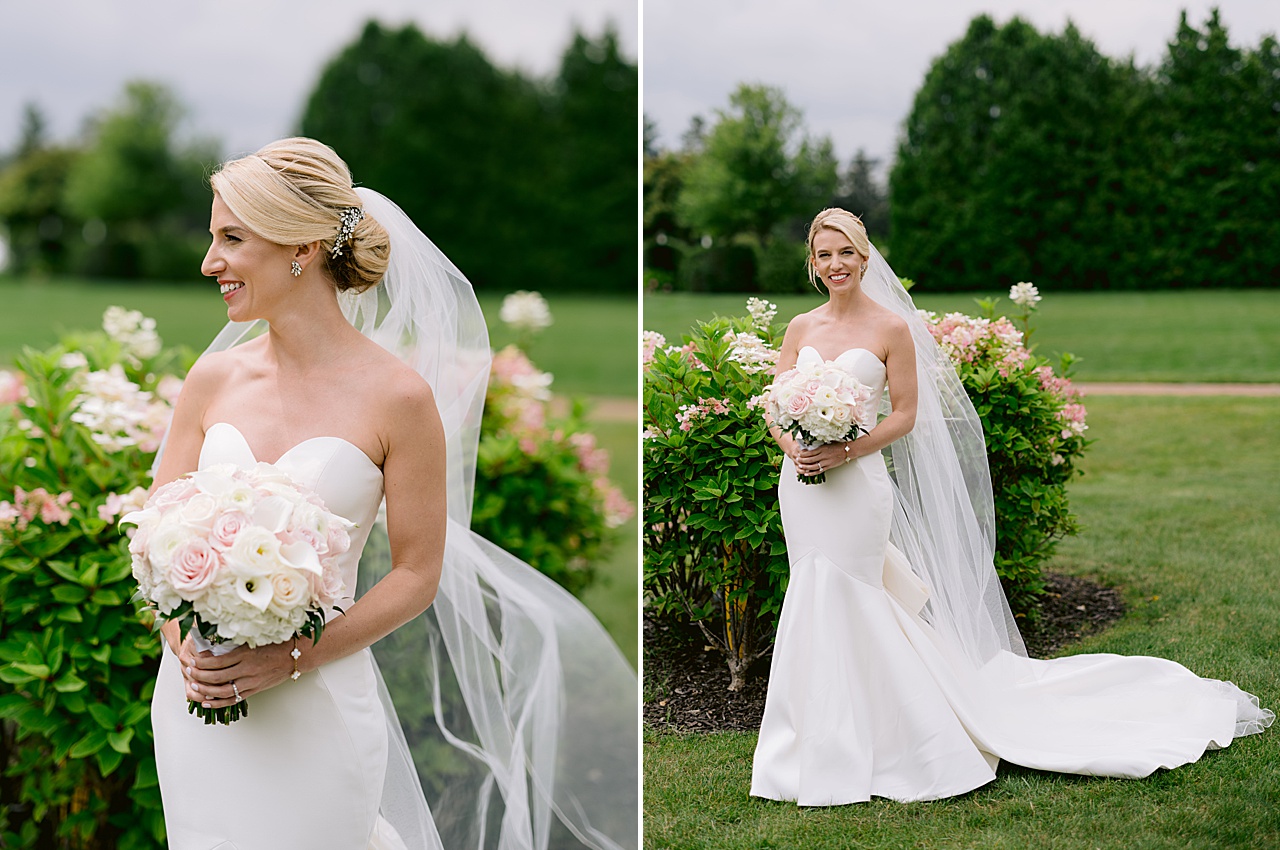 Portraits of a bride in her gown with pink and white hydrangeas and Michigan trees behind her