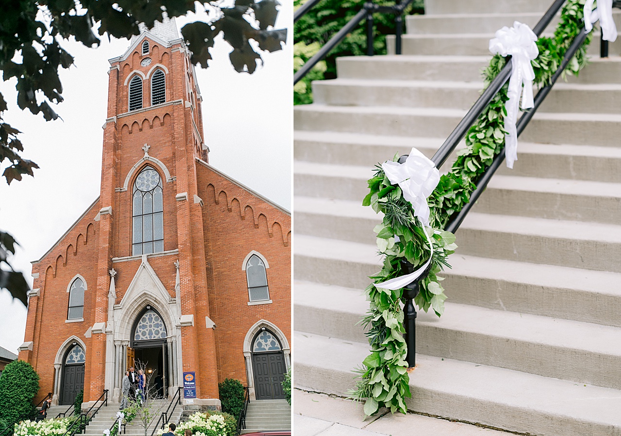 A photo of a red brick church and stairs with greenery wrapped stair railing