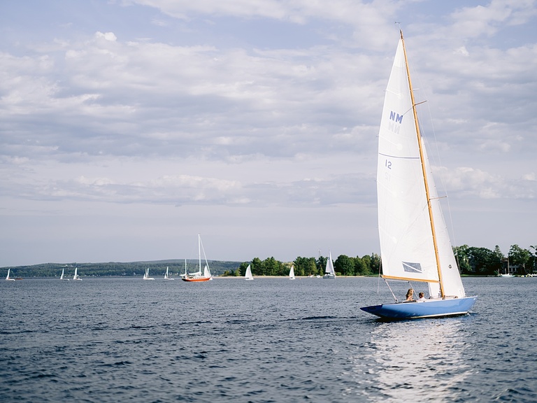A couple sailing around Harbor Point in Little Traverse Bay
