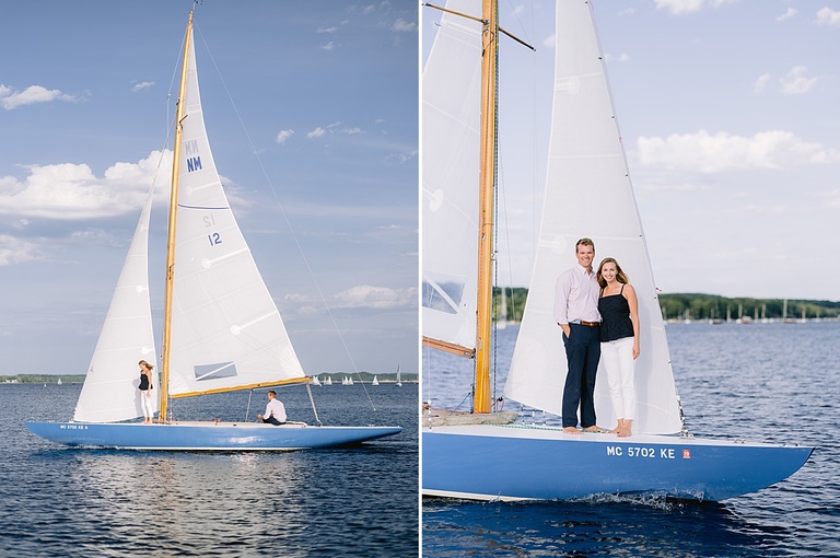 A couple standing on the front of a boat on Little Traverse Bay