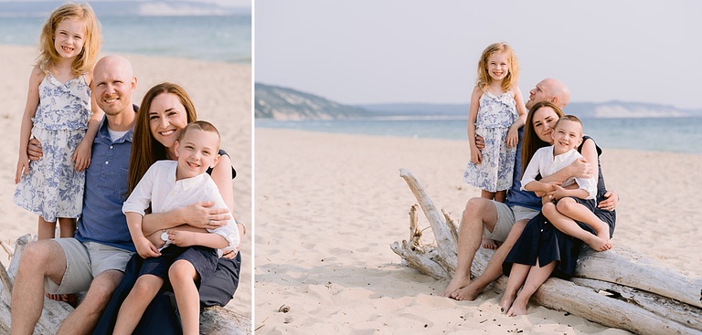 A family poses for portraits on a piece of driftwood on a beach in Michigan
