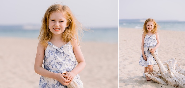 A girl poses in portraits on a sandy beach in the sun in Michigan