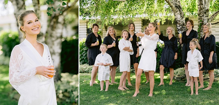 A bride and her bridesmaids outside on a sunny day in Michigan opening a bottle of champagne and laughing