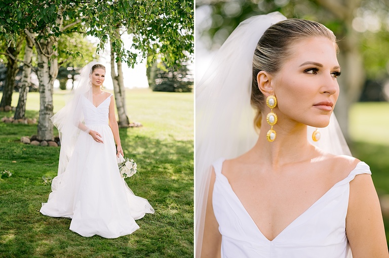 A bride holding her long veil while taking bridal portraits in lower Michigan