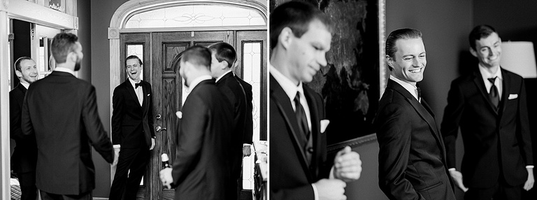 A groom laughing with his groomsmen while getting ready for the wedding ceremony