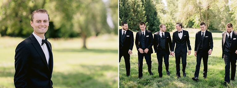 A groom taking portraits in a sunny, grassy field with his groomsmen in lower Michigan