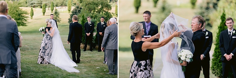 A bride hugging her mother and father during the ceremony