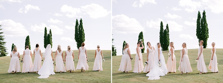 A bride and bridesmaids walking together in the county in Michigan