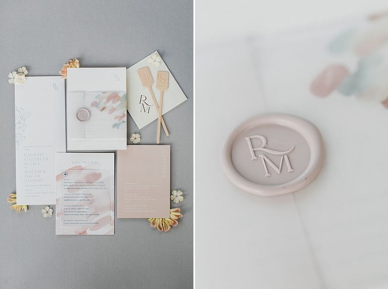 A wedding invitation suite with pastel accents