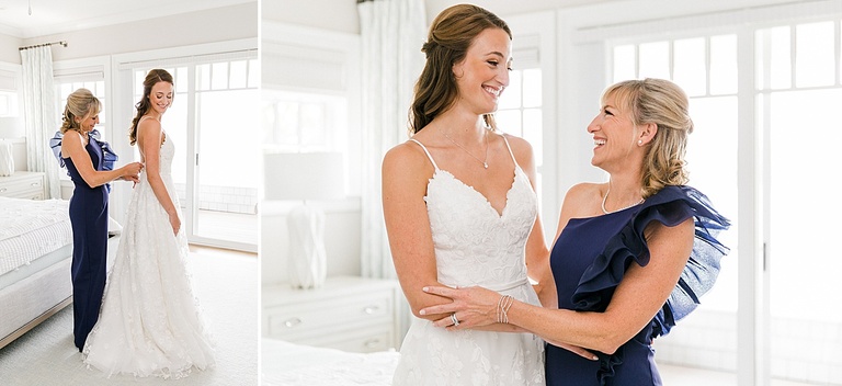 A mother of the bride helping her daughter get into her wedding dress on a sunny day on Walloon Lake, Michigan