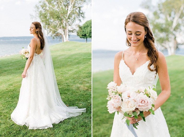 A portrait of a bride on her wedding day near a lake in her white Paloma Blanca dress