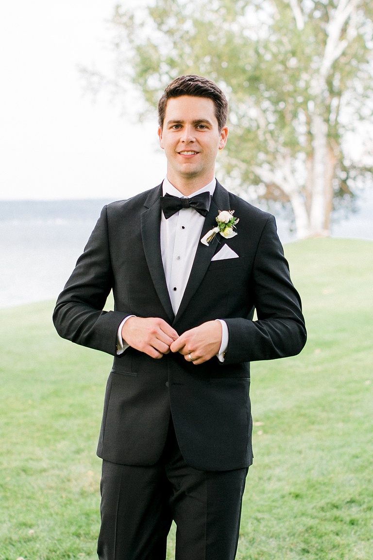 A groom smiling on his wedding day